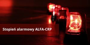 Na czerwonym tle napis stopień alarmowy Alfa-CRP obok kilka włączonych sygnałów świetlnych koloru czerwonego