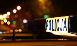 zdjęcie przedstawia neon z napisem policja